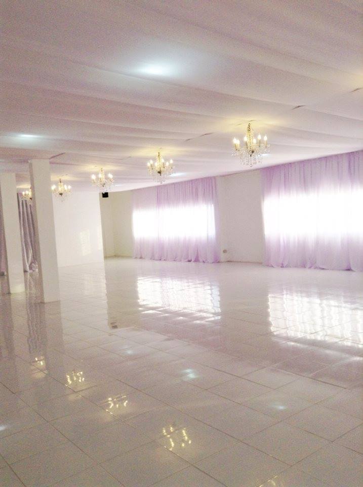 Open space venue with chandeliers and light decoration