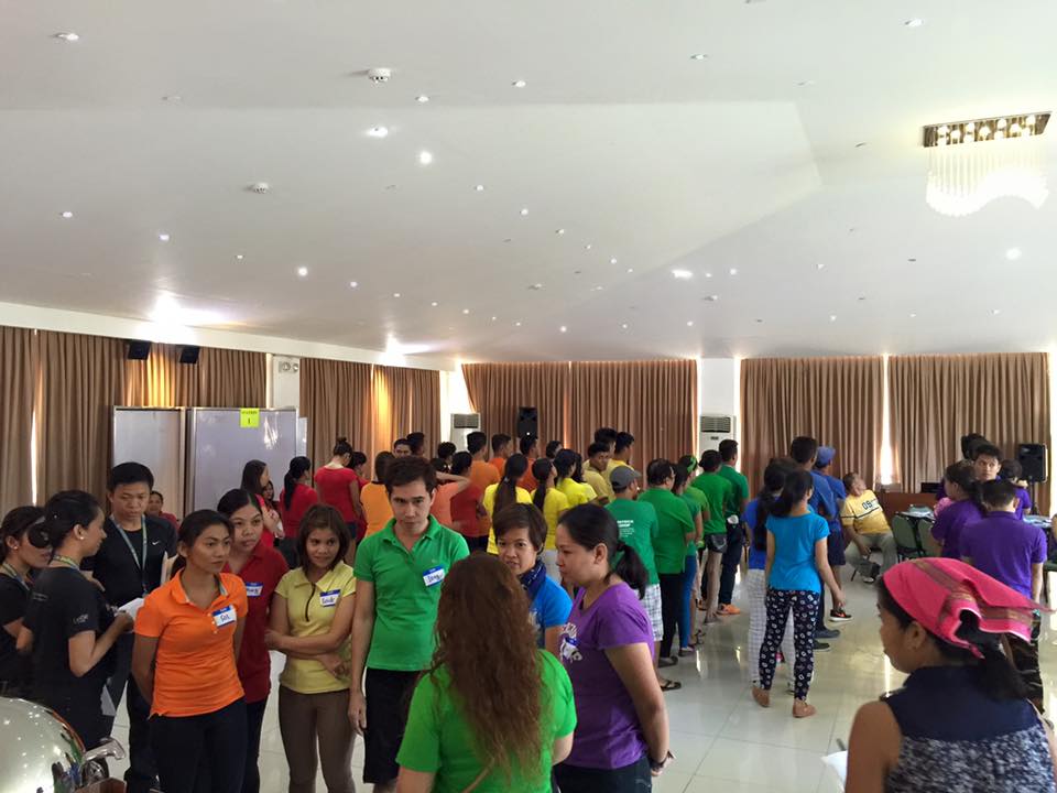 Team building of a company with different coloured shirts