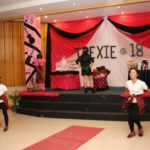Dance number of three girls on stage of an 18th debut birthday decorated with black and red music theme