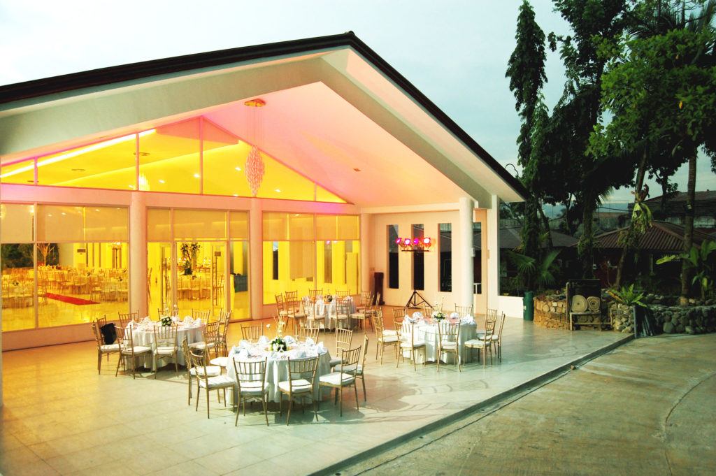 Functional hall with outdoor tables and chair area for dining