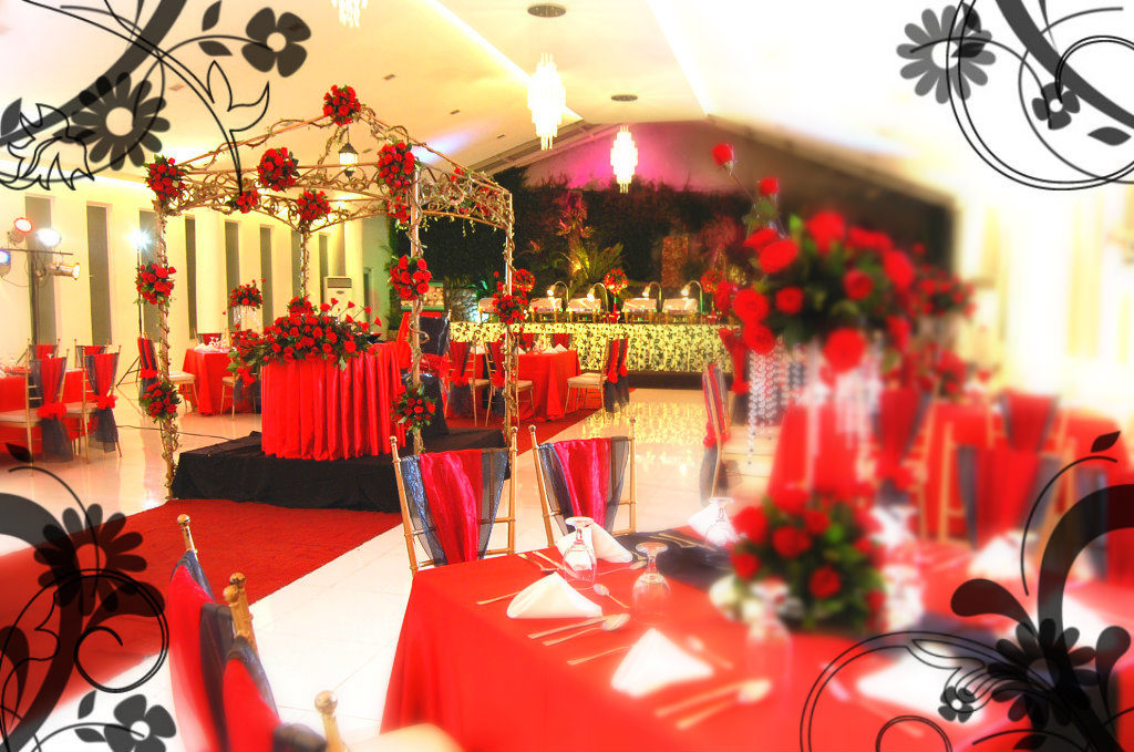 Event venue decorated with red roses, black and red coloured theme