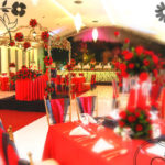 Event venue decorated with red roses, black and red coloured theme