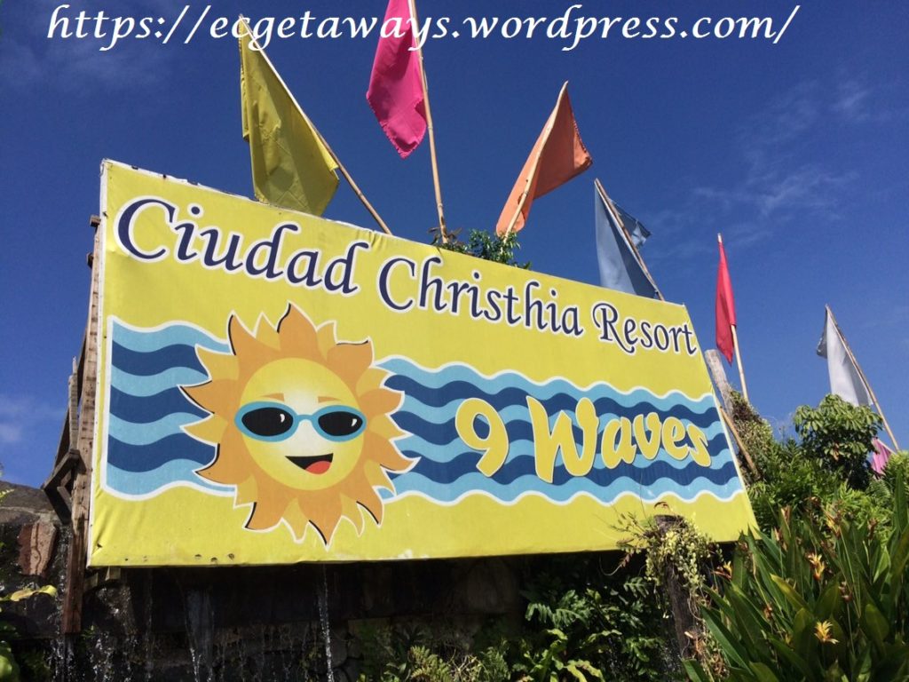 Ciudad Chrstia Resort's 9 Waves tarpaulin banner with colorful flags